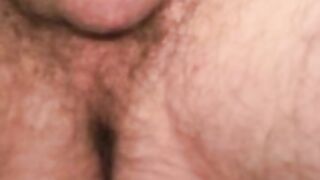 Handsome hairy dude plays with his dick and splooges solo