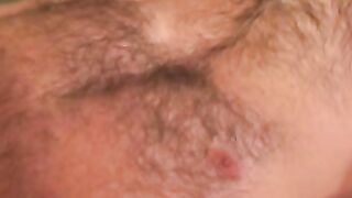 Handsome hairy dude plays with his dick and splooges solo