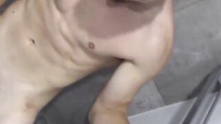 Muscular amateur jock shows off his abs in the shower