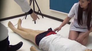 Voluptuous Japanese nurse strokes and gives blowjob to guy