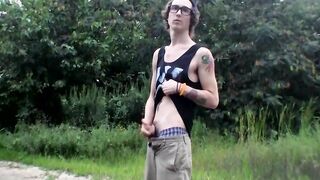 Outdoor pissing and masturbation with tattooed thug with glasses