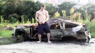 Muscular jock Elijah Knight wanks off his fat cock outdoors
