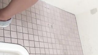 Pissing Japanese babe enjoying her time in public toilette