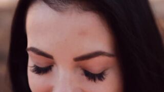 Nubile is spreading her shaved pussy while in the forest