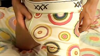 Cute cock guzzler lowers his undies and masturbates solo
