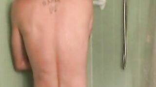 Seasoned worker tugs his dick in the shower and cums solo