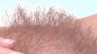 Natural tits MILF Enza playing with her hairy juicy pussy