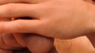 Inked jock massaging his big balls and wanking pierced cock