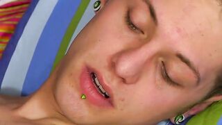Twink wanking then slides glass dildo deep in his ass