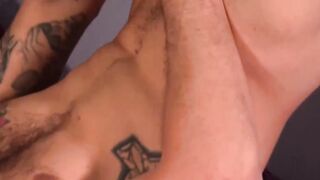 Inked man is stroking his large cock and empties his balls