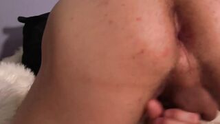 Inked man is stroking his large cock and empties his balls