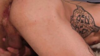 Inked man is stroking his large cock and empties his balls