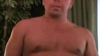 Muscular older guy shows off cock before rubbing it