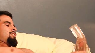 Tattooed gay tickles his big balls and stroking his big cock