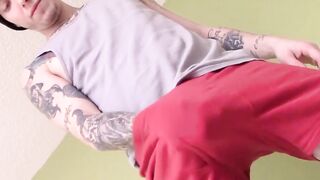 Tattooed straight thug plays with his small cock and cums