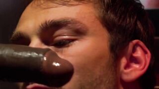 Two horny guys blowing each others dicks through glory hole