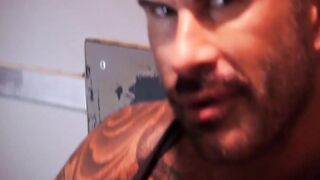 Two horny guys blowing each others dicks through glory hole
