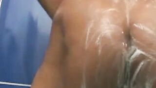 Gay Brazilian jerks off and dildoes his ass while bathing