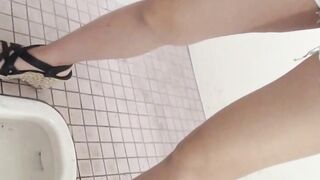 Japanese ladies taped pissing in public bathroom