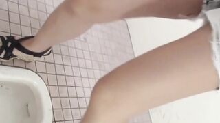 Japanese ladies taped pissing in public bathroom
