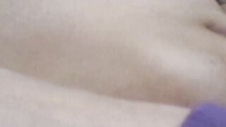 Young Japanese lady fingering her pussy while being filmed