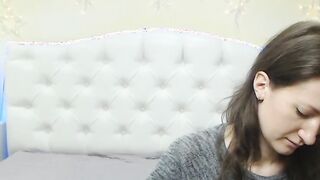Sexy brunette caresses her chest on webcam