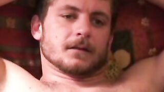 Handsome gay man stroking big cock before cumshot