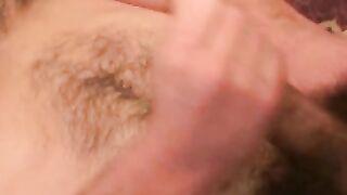 Handsome gay man stroking big cock before cumshot