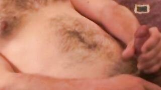 Handsome gay man stroking big cock before cumshot