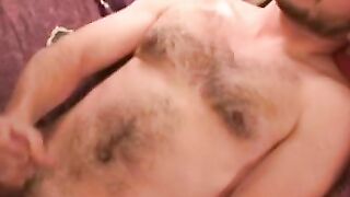 Handsome gay man stroking big cock before cumshot