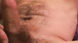 Handsome gay man stroking big cock before cumshot