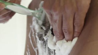 Sensual babe Laurene K shaves her wet hairy pussy solo