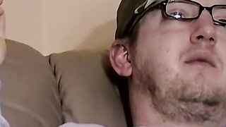 Cute amateur Jack with glasses masturbates on a leather sofa