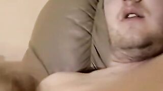 Cute amateur Jack with glasses masturbates on a leather sofa