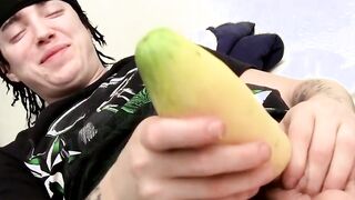 Young thug tugging his cock with cucumber help
