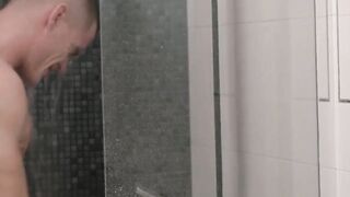 Big dicked jock takes a shower before taking a stroke