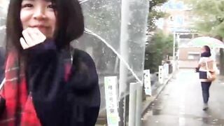 Cute Japanese chick has vibrator pleasing her in the rain