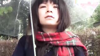 Cute Japanese chick has vibrator pleasing her in the rain