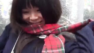 Cute Japanese chick has vibrator pleasing her in the rain