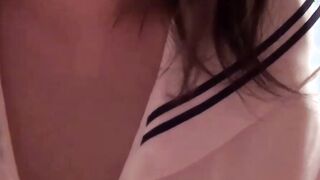 Petite Japanese schoolgirl rubs her soft pussy and nipples