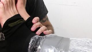 Submissive gay slave toe licked and sucked while tied up