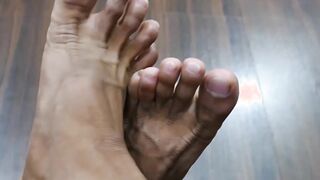 Adorable twink beating his meat and playing with his feet