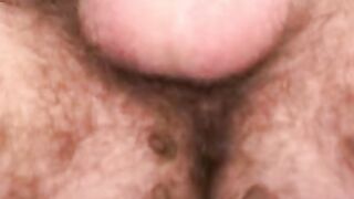 Curly amateur works on his cock and blasts out a load