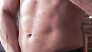 Fabulous homo showing off muscles while masturbating solo