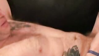 Inked bald guy shows off cock stroking skills and cumshot