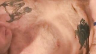 Inked bald guy shows off cock stroking skills and cumshot