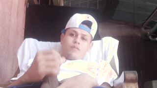Outdoor wanking with sexy young Latino wearing baseball cap