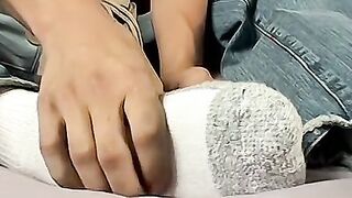 Stroking their dicks while intertwining feet for cute twinks