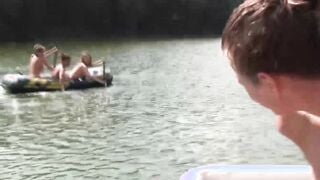 Group of naughty teens is having fun while swimming outdoor