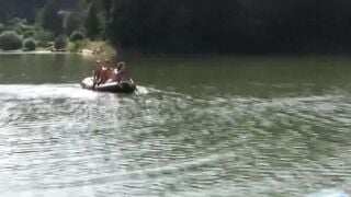 Group of naughty teens is having fun while swimming outdoor